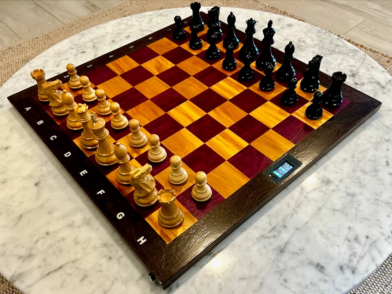 Liminal Chess, a hardwood chessboard with a small display set into its frame